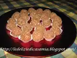 Ricetta Tartufini dolci al mascarpone e cereali profumati all'arancio e ripieni di nocciolata