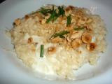 Ricetta Risotto mantecato con crescenza e nocciole