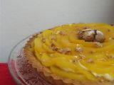 Ricetta Crostata di amaretti con crema al marsala e pesche sciroppate