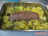 Ricetta Polpettone ripieno di prosciutto cotto e mozzarella con patate al forno