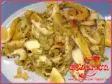 Ricetta Anelli di calamaro e seppie gratinati al forno