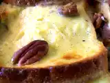 Ricetta Pudding di pane alle banane, cioccolato e noci pecan