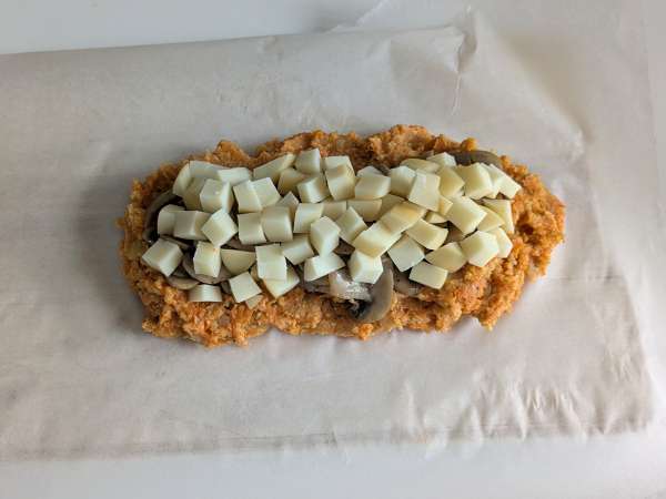 Polpettone di zucca con funghi e scamorza filante: ricetta gustosa e facile al forno - Preparazione tappa 9