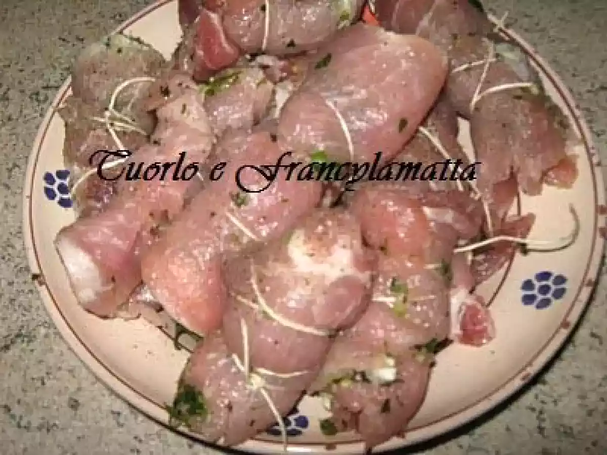 Braciole di maiale sotto grasso