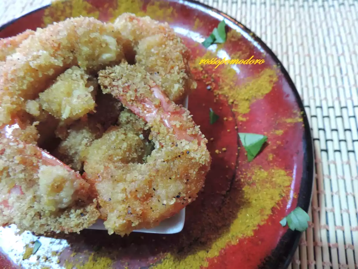 Gamberoni al curry gratinati al forno