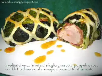 Involtini di verza in rete di sfoglia, glassati al pompelmo rosa con filetto di maiale