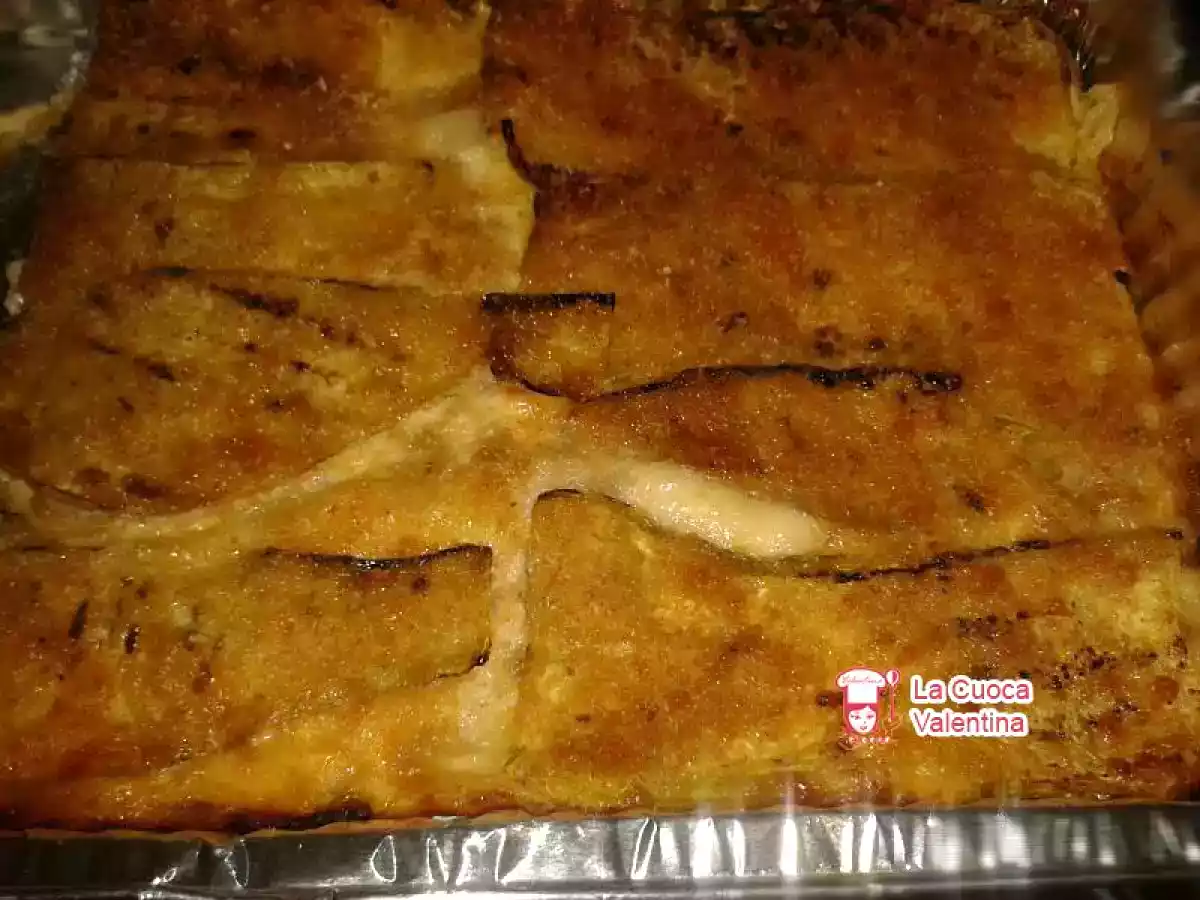 Parmigiana di zucchine con gratin di uova e formaggio