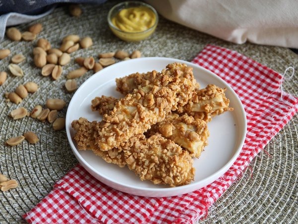 Pollo impanato alle arachidi, la ricetta al forno che stupirà i tuoi ospiti!