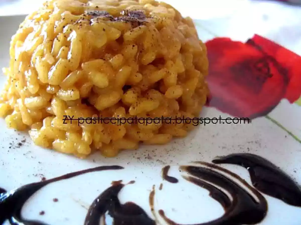 Risotto allo zafferano con salsa alla liquirizia