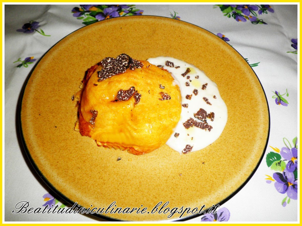 Sformatini di zucca su fonduta di pecorino al tartufo nero