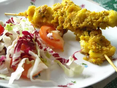 Spiedi di seppioline e totani gratinati al curry