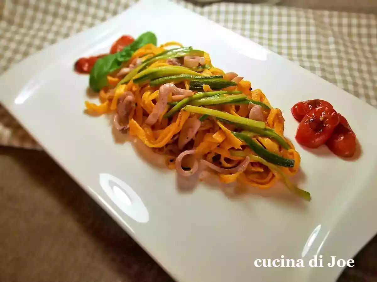 Tagliolini con calamari spillo, al pesto di mandorle e ricotta infornata.